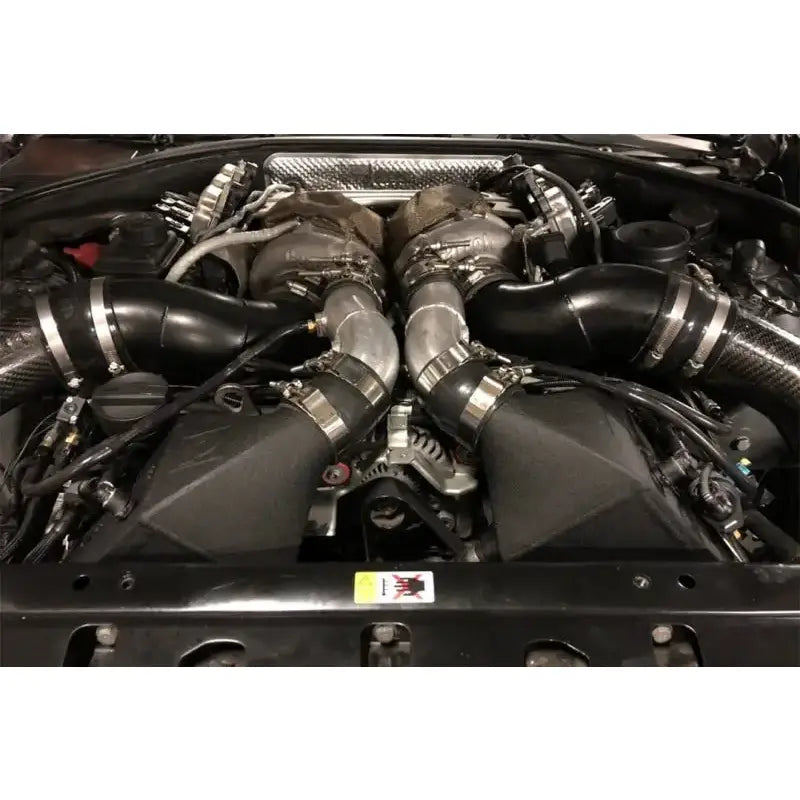 Car engine with twin turbochargers from CSF crinkle black twin charge-air-cooler set