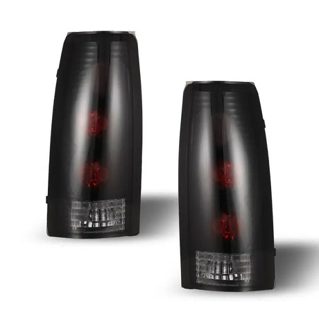 Pair of blacked-out taillights for Cadillac Escalade CTWJ-0003-BS Winjet 1999-2000