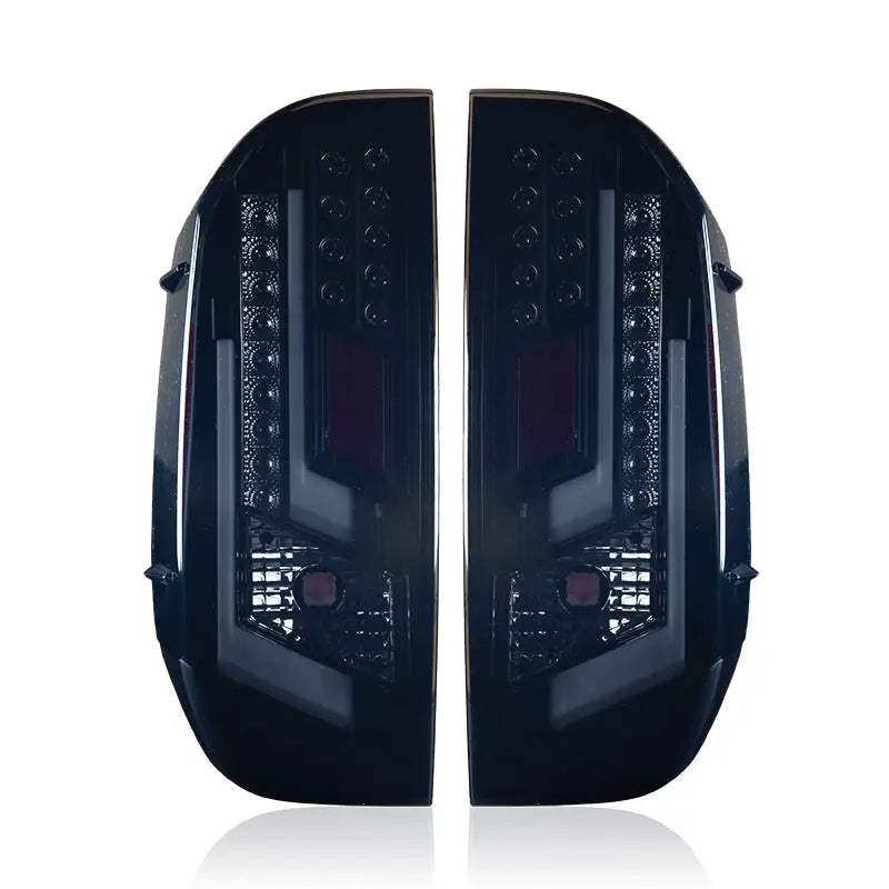 Pair of dark aftermarket tail lights for Toyota Tundra CTWJ-0377-BS Winjet