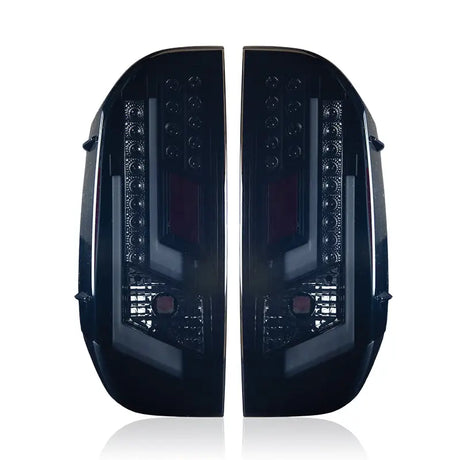 Pair of dark aftermarket tail lights for Toyota Tundra CTWJ-0377-BS Winjet