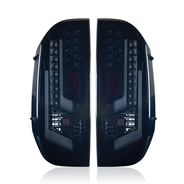 Pair of dark aftermarket tail lights for Toyota Tundra CTWJ-0377-BS Winjet