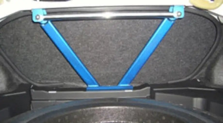 Blue Cusco Power Brace rear in car trunk for enhanced stability and performance
