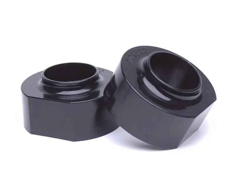Two black coil spring lift spacers for Jeep Cherokee XJ 2&4WD, perfect for upgrades