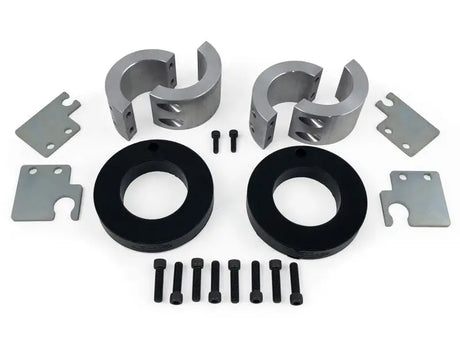 Daystar 2014-2020 Jeep Grand Cherokee 2.0 Inch Lift Kit components including spacers, bolts, and metal plates.