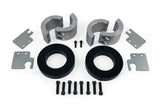 Daystar 2014-2020 Jeep Grand Cherokee 2.0 Inch Lift Kit components with front and rear lift spacers, screws, and metal plates laid out.