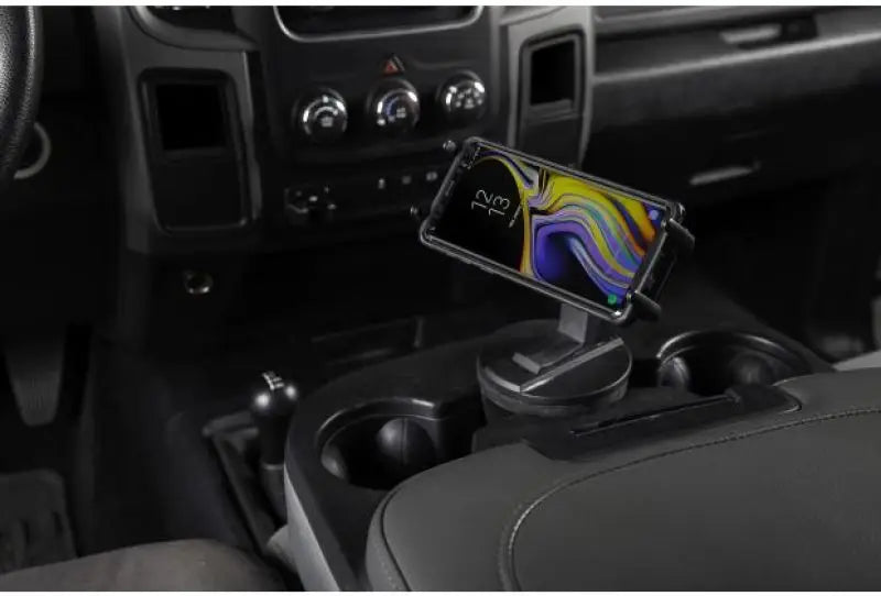 Daystar Universal Hands-Free Phone Grip installed in vehicle’s cup holder, showcasing 360° view rotation, durable polyurethane construction, Truck & Automotive, AVADA - Best Sellers