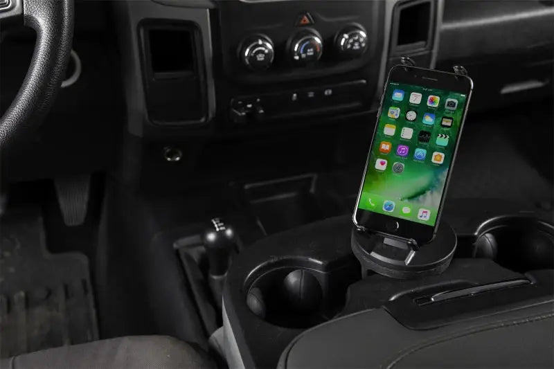 Daystar Universal Hands-Free Phone Grip in a vehicle's cup holder, ensuring secure and convenient smartphone placement with 360° view rotation, suitable for RV, Automotive, Powersports, off-road, marine, exterior, truck accessories, interior, truck bed, RV parts, Truck & Automotive, AVADA - Best Sellers