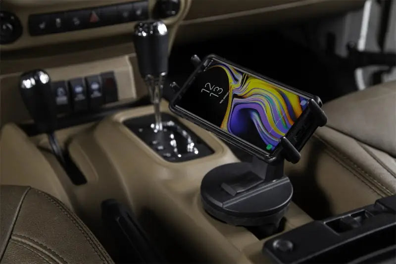 Black Daystar Universal Hands-Free Phone Grip installed in vehicle cup holder, rotating mount with smartphone, RV, Automotive, Powersports, off-road, marine, exterior, truck accessories, interior, truck bed, rv parts, Truck & Automotive, AVADA - Best Sellers