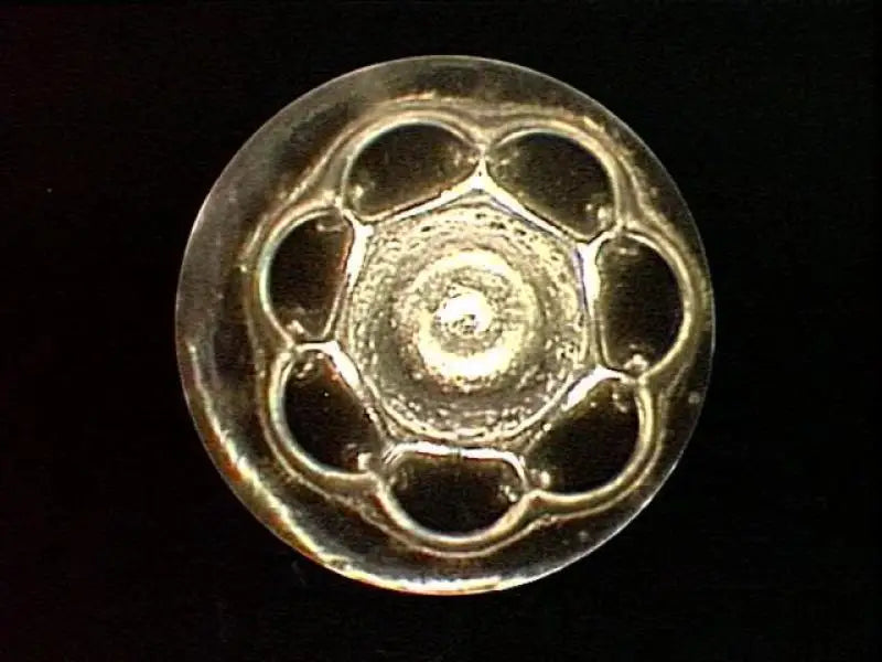 Ornate metallic ddp duramax injector set button with hex center and petal design