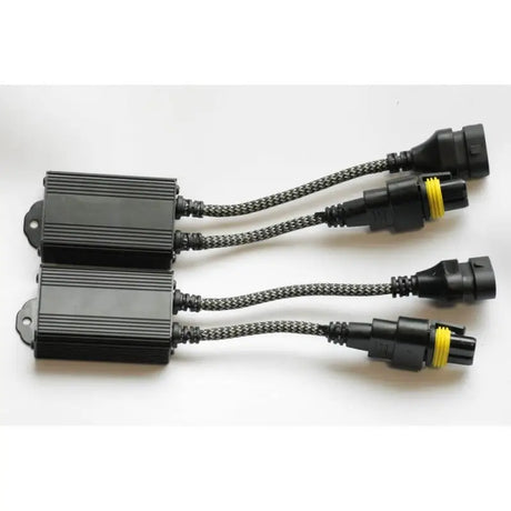 Two black rectangular HID ballasts with braided cables and waterproof connectors.