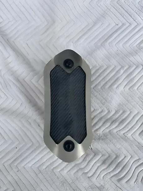 Silver and carbon fiber DEI Flex Heatshield Gen III for motorcycle exhaust protection