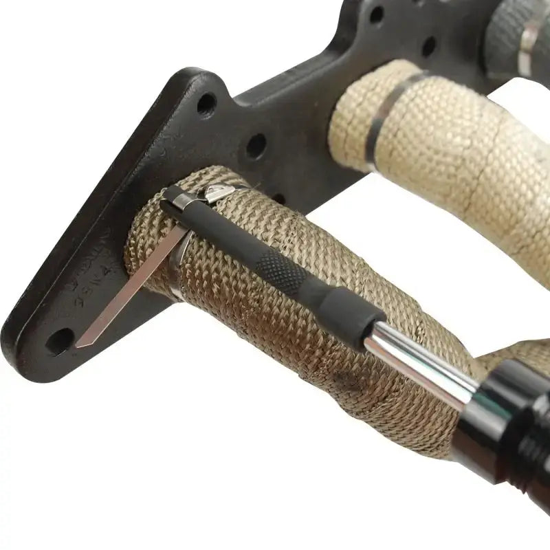DEI Locking Tie Tool securing a header wrap with stainless steel locking ties.