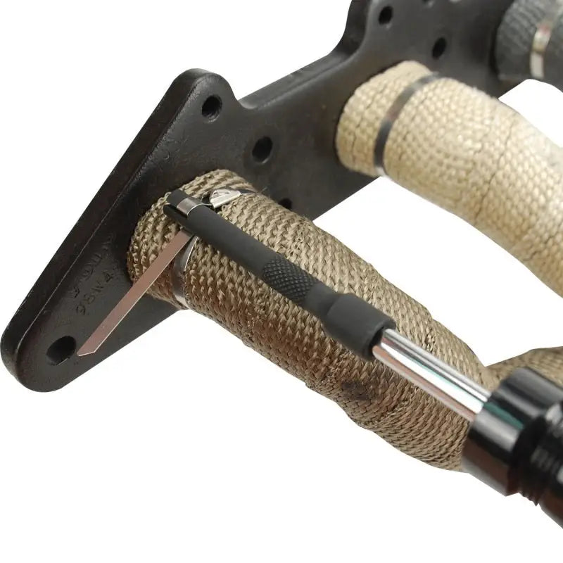 DEI Locking Tie Tool securing header wrap with stainless steel locking ties.