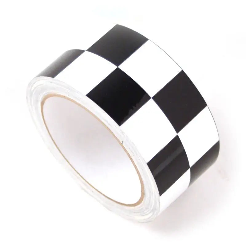 Checkered black and white DEI Speed Tape roll for fast fixes and projects