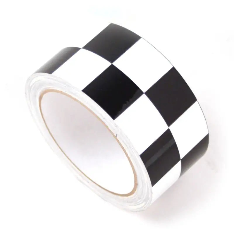 Checkered black and white DEI Speed Tape roll for quick fixes and repairs