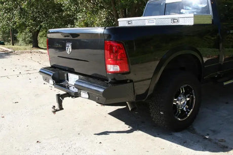 DR10-T2950-1 Fab Fours 10-14 Ddg Hd Rh Rear heavy-duty rear bumper on black vehicle, offering robust protection and enhanced rugged style.