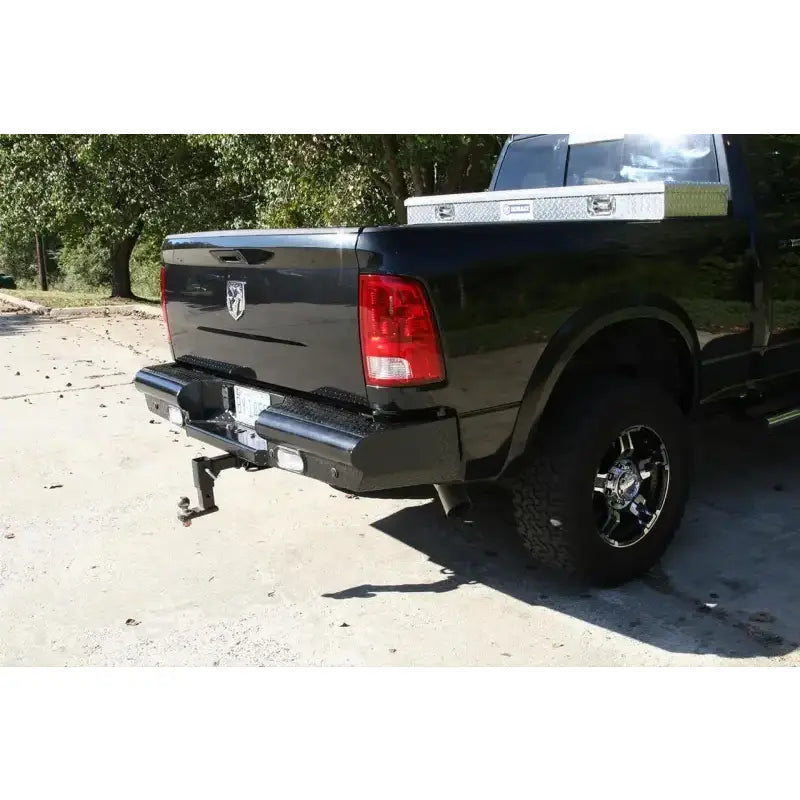 DR10-T2950-1 Fab Fours 10-14 Ddg Hd Rh Rear heavy-duty rear bumper on black vehicle, offering robust protection and enhanced rugged style.