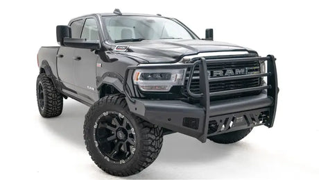 DR19-Q4460-1 Fab Fours Black Steel Elite Front bumper on a rugged, black RAM truck showcasing enhanced front-end protection and aggressive style.