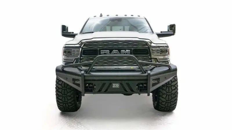 Front view of a white RAM truck equipped with a Fab Fours Black Steel Elite Front bumper, showcasing its durable and rugged black steel construction against a white background.