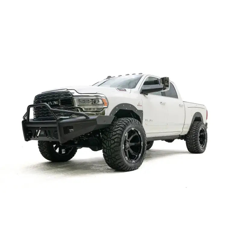 DR19-Q4462-1 Fab Fours Black Steel Elite Front bumper on a white off-road truck.