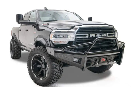DR19-S4462-1 Fab Fours Black Steel Front bumper on a rugged truck, showcasing durable high-quality steel construction and a sleek black finish for bold protection and style.