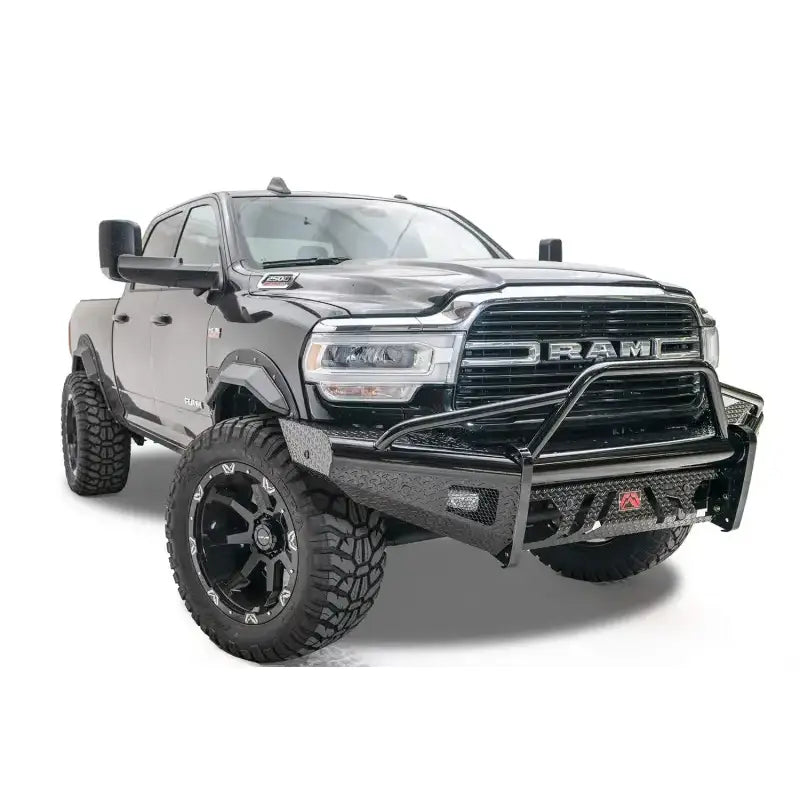 DR19-S4462-1 Fab Fours Black Steel Front bumper on a rugged truck, showcasing durable high-quality steel construction and a sleek black finish for bold protection and style.