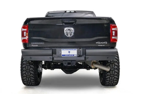 DR19-U4450-1 Fab Fours Black Steel Elite Rear bumper on a black truck, showcasing superior rear-end protection with a rugged, off-road design. Perfect for RV, automotive, powersports, marine, and truck accessories enthusiasts. Bumpers, Grilles & Guards, AVADA - Best Sellers, Must Haves