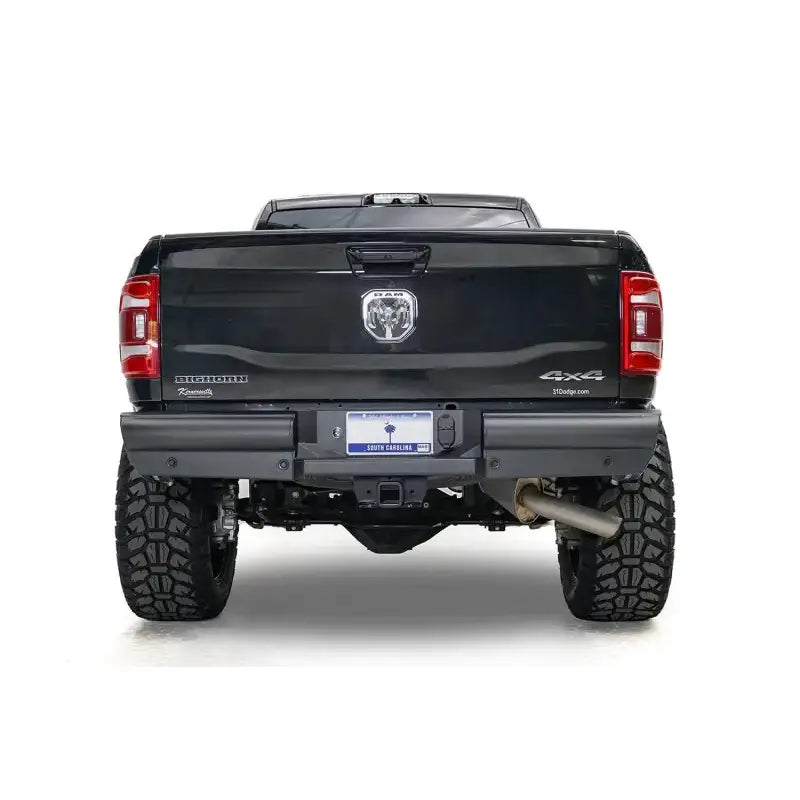 DR19-U4450-1 Fab Fours Black Steel Elite Rear bumper on a black truck, showcasing superior rear-end protection with a rugged, off-road design. Perfect for RV, automotive, powersports, marine, and truck accessories enthusiasts. Bumpers, Grilles & Guards, AVADA - Best Sellers, Must Haves