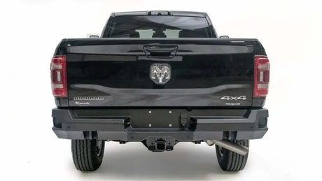 Rear view of a black Dodge Ram 2500-3500 Big Horn 4x4 with Fab Fours Premium DR19-W4451-1 bumper installation.