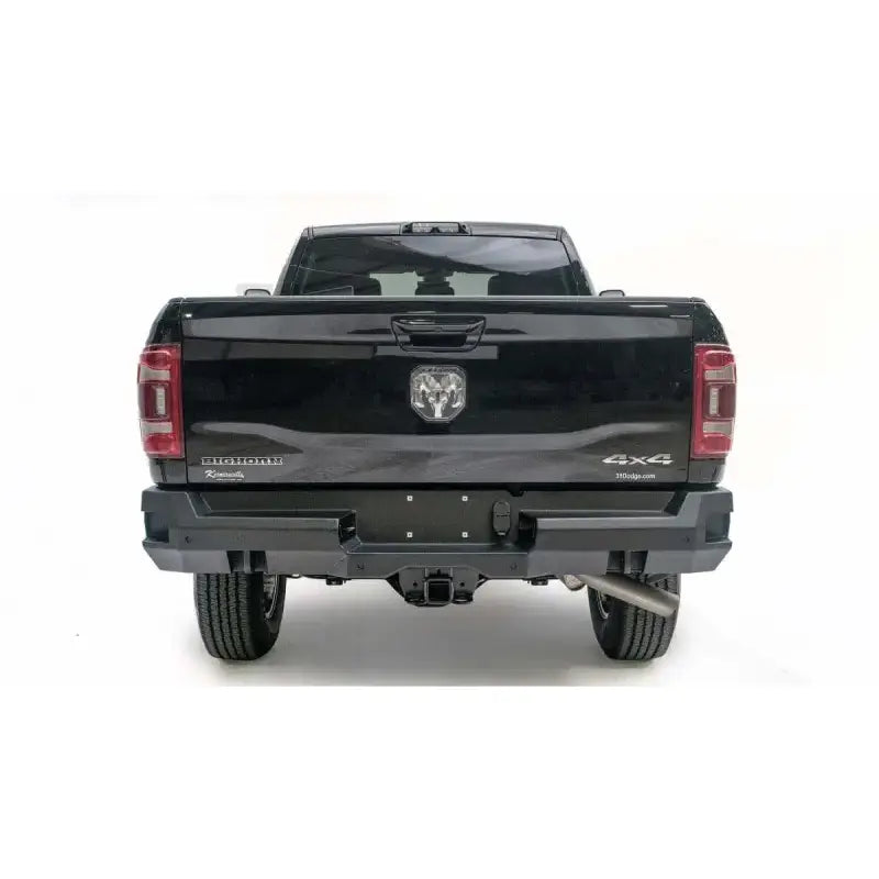 Rear view of a black Dodge Ram 2500-3500 Big Horn 4x4 with Fab Fours Premium DR19-W4451-1 bumper installation.