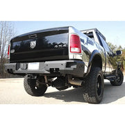 Rear view of a 2019 Dodge Ram 2500-3500 equipped with the premium Fab Fours DR19-W4451-1 bumper, showcasing rugged design and high-quality construction.