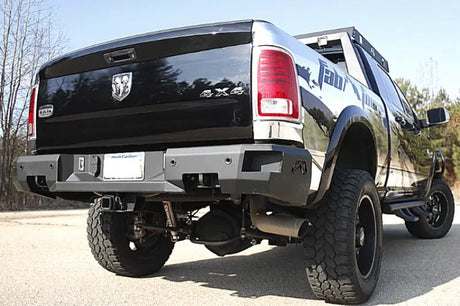 Rear view of a 2019 Dodge Ram 2500-3500 equipped with the premium Fab Fours DR19-W4451-1 bumper, showcasing rugged design and high-quality construction.