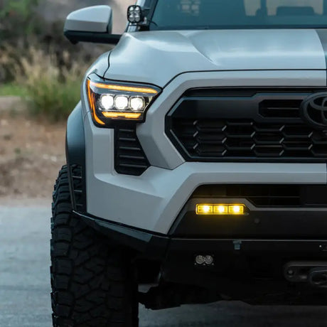 Driving/ Fog Light LED Bulb; Dual Color LUXX Chip; Rectangular; 12.2 Watt; Projector Beam; 720 Lumen For White/ 716 Lumen For Yellow/ 1200 Raw Lumen; Clear Polycarbonate Lens; Alpha-Black Polypropylene Housing; 6500 Degree Kelvin White Color Temperature/ - NTP