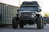 DV8 Offroad 18-23 Wrangler JL/Gladiator JT Spec Series Front Bumper on a Jeep with a Warn 12s EVO winch and mounted light bar.