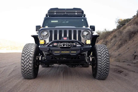 DV8 Offroad Spec Series Front Bumper on 2018-2023 Wrangler JL/Gladiator JT with high clearance design and winch mount.