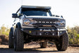 2021+ Ford Bronco equipped with DV8 Offroad MTO Series Front Bumper, winch-ready with optional bull bar and aux light opening.