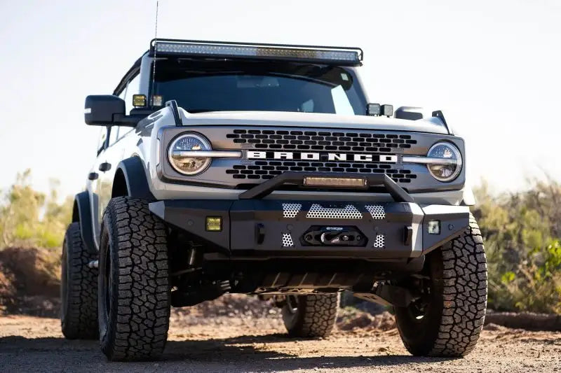 2021+ Ford Bronco equipped with DV8 Offroad MTO Series Front Bumper, winch-ready with optional bull bar and aux light opening.