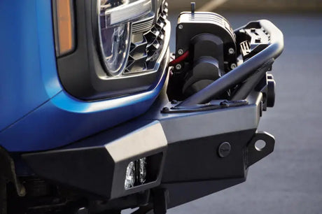 DV8 Offroad 21-23 Ford Bronco Spec Series Front Bumper with winch and bull bar, showcasing rugged design and lighting options.