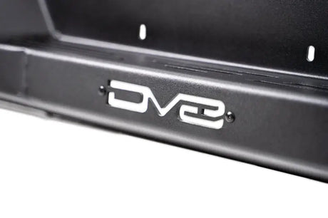 DV8 Offroad 21-23 Ford F-150 MTO Series Rear Bumper close-up showcasing branding and steel construction.