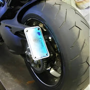 Motorcycle tire with license plate setup featuring DVL-FE Fender Eliminator DUC for sleek look