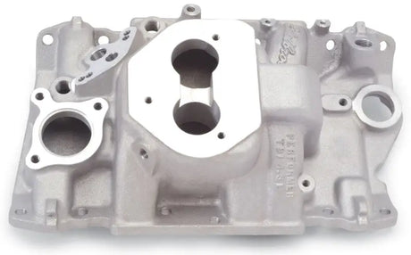 Silver Edelbrock Performer TBI manifold with four-barrel carb flange for V-6 engines