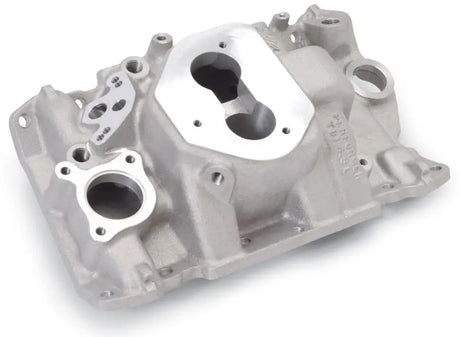Silver-colored cast aluminum Edelbrock Performer TBI manifold for 4.3 V-6 engines