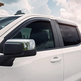 White pickup truck with chrome mirror and EGR 2019 Chevy 1500 window visors