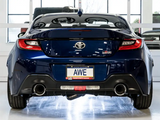 Rear view of a blue sports car featuring AWE's Touring Edition Cat-Back Exhaust System Kit, showcasing dual chrome silver tips and rear exit exhaust.