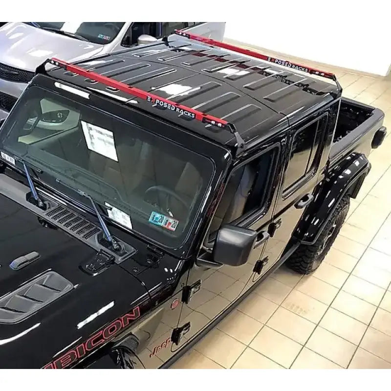 2019 Jeep Gladiator Rubicon black pickup with red accents and Exposed Rack 8-00-9755-RD roof rack kit