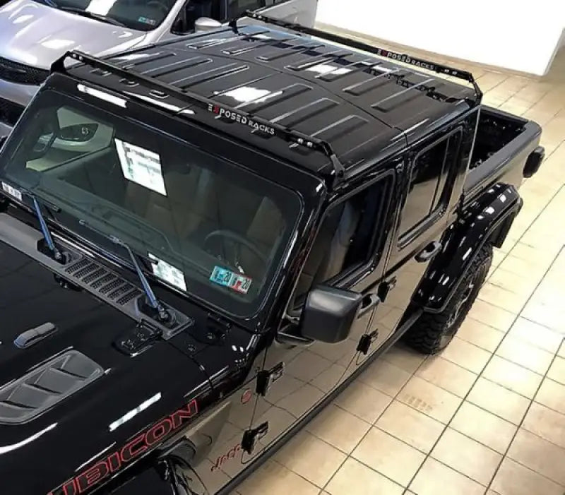 Black Jeep Wrangler Rubicon with Exposed Rack 8-00-9755-RD roof rack kit and spare tire