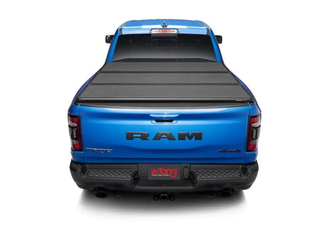 Blue Ram pickup with tonneau cover shown, fits Extang Solid Fold ALX for Dodge Ram