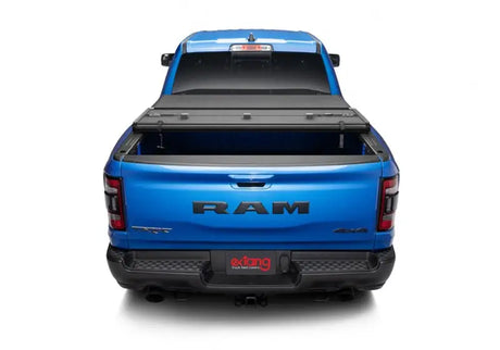 Blue Ram pickup with tonneau cover on dodge ram solid fold alx bed truck