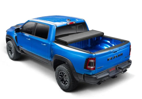 Blue Ram pickup with tonneau cover on Dodge Ram Solid Fold ALX bed tonneau