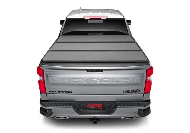 Silver pickup truck with solid fold alx bed cover for Chevy/GMC Silverado/Sierra 1500